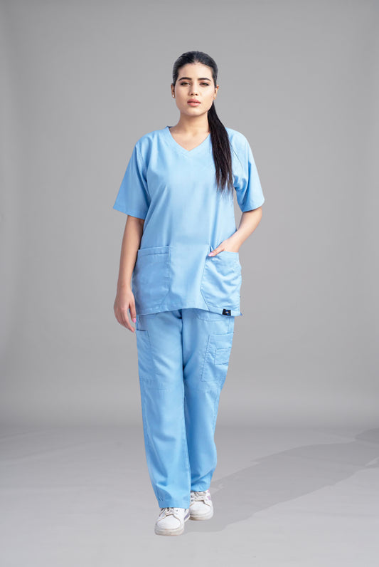 Classic Curve™ dusk blue scrub for women by Gtex Apparels in Pakistan, designed for practical healthcare work environments 1