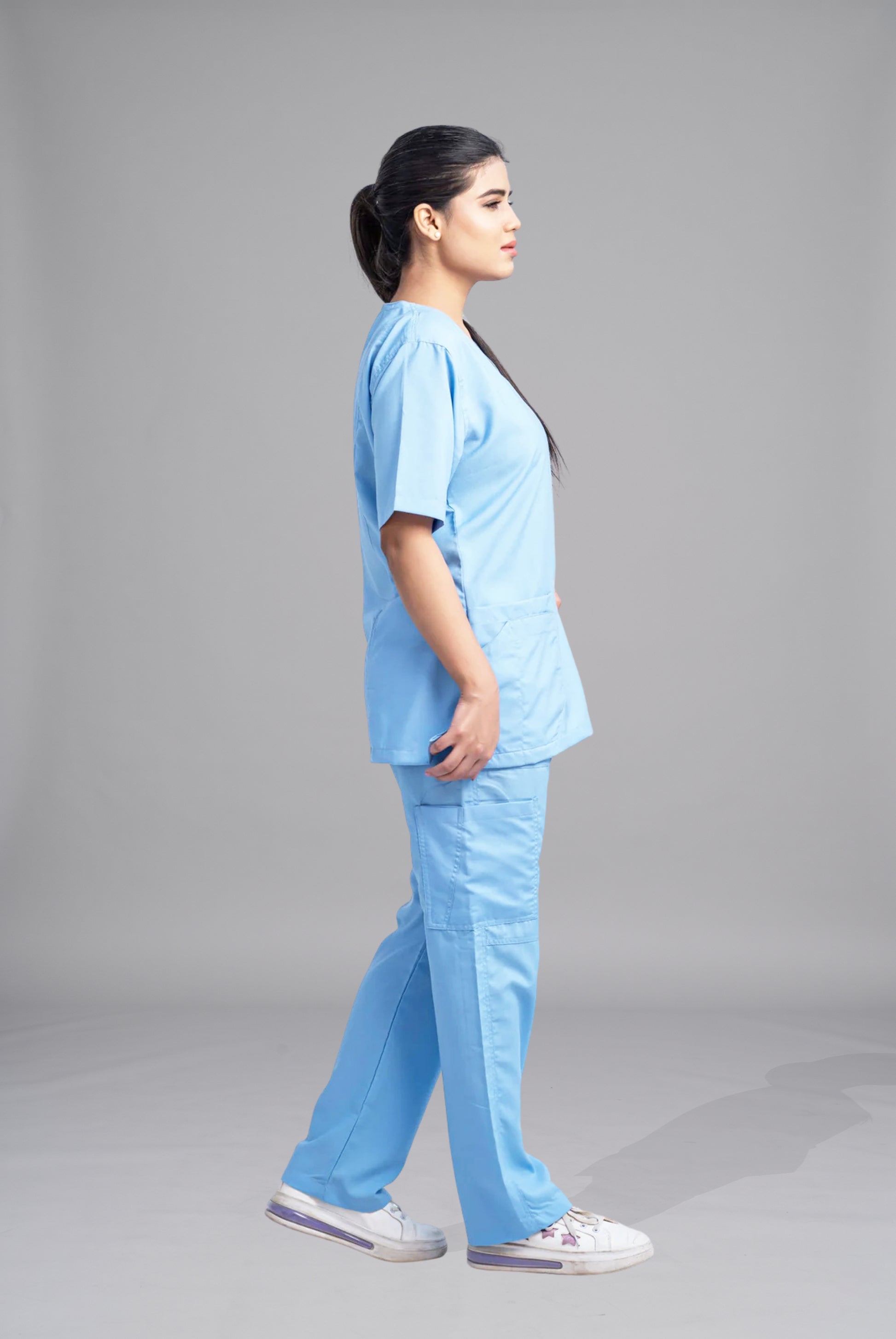 Classic Curve™ dusk blue scrub for women by Gtex Apparels in Pakistan, designed for practical healthcare work environments 1