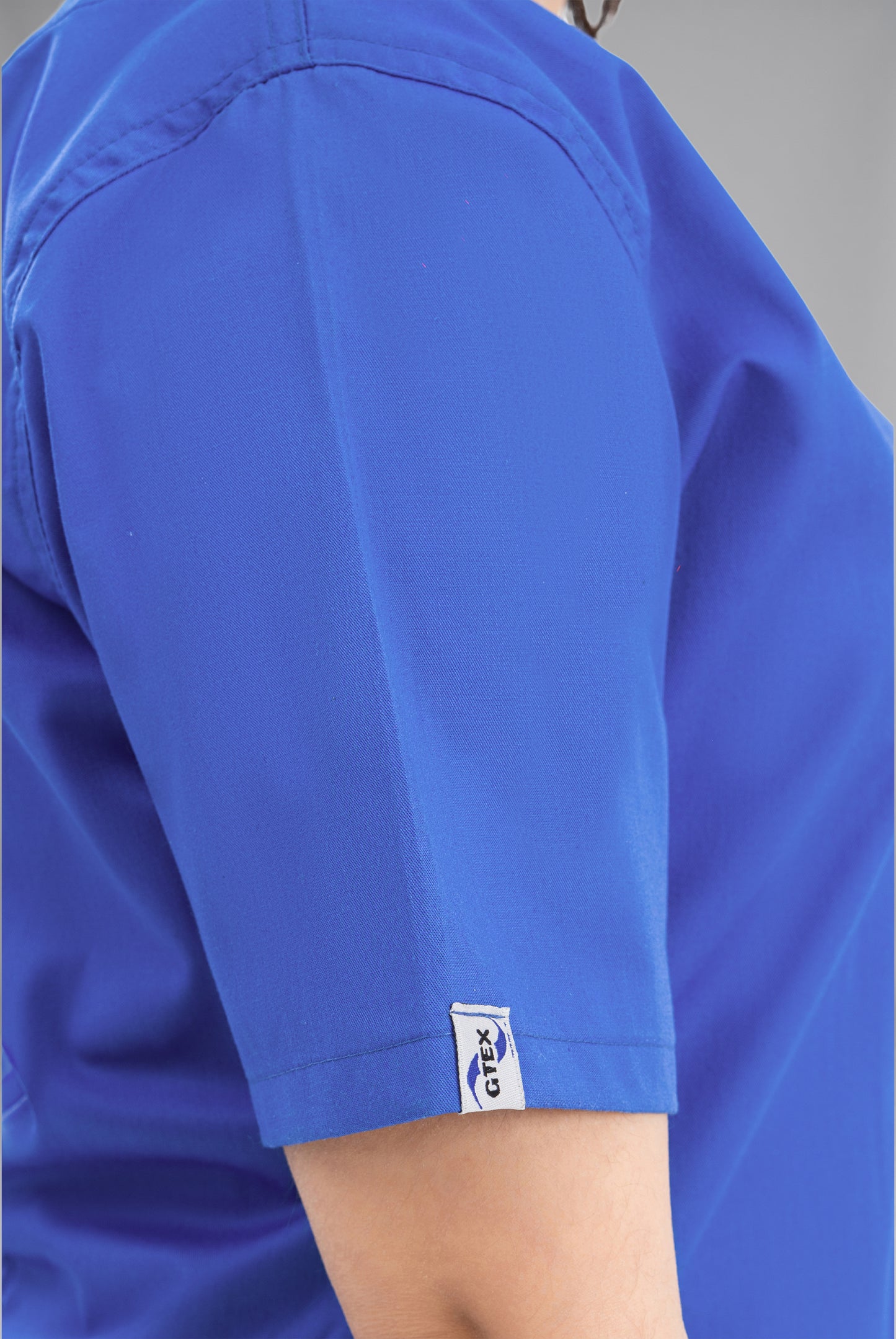 Buy Classic Curve royal blue scrub for women in Pakistan by Gtex Apparels, designed for comfortable daily professional use in healthcare environments 6