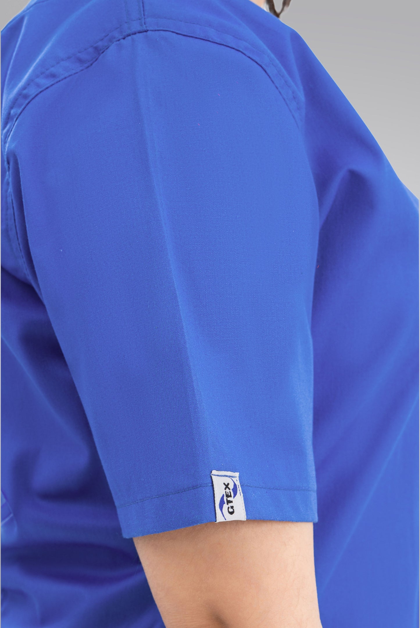 Buy Classic Curve royal blue scrub for women in Pakistan by Gtex Apparels, designed for comfortable daily professional use in healthcare environments 4