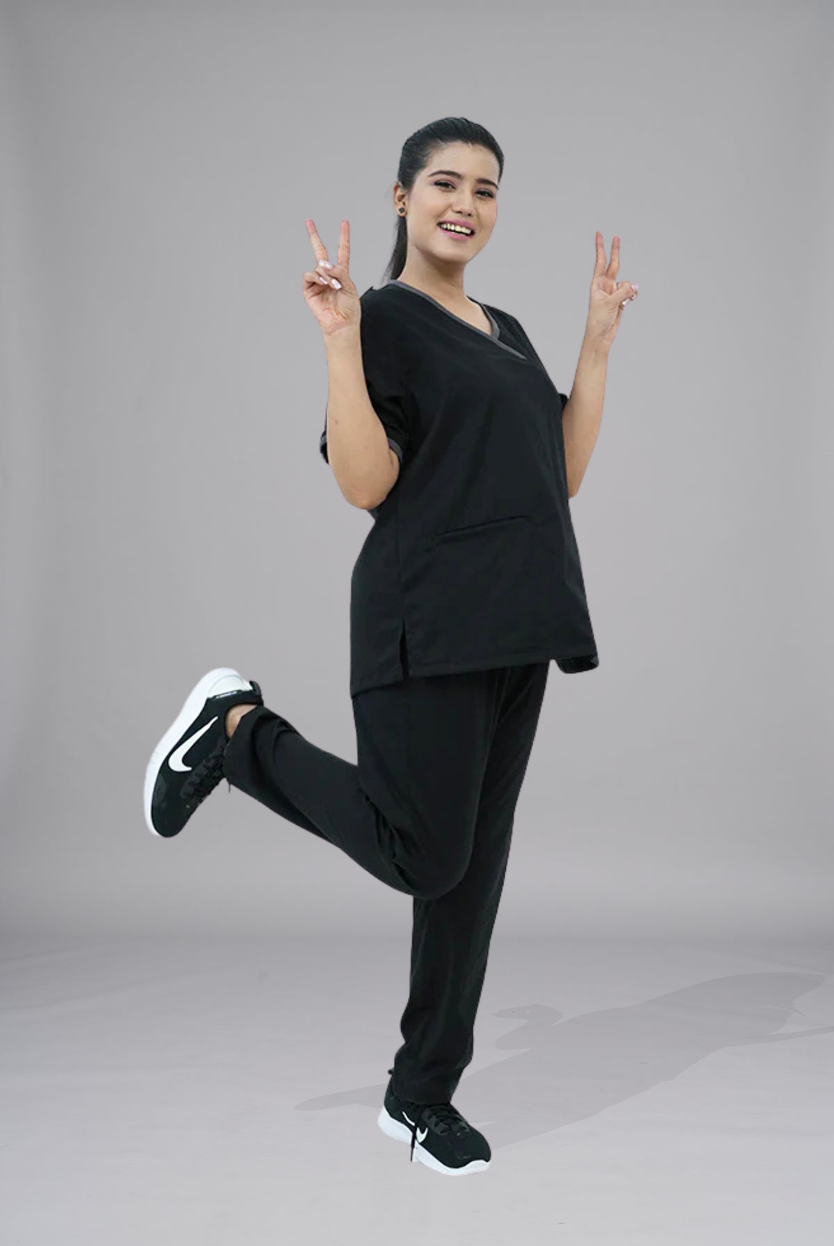 Buy Elite Notch black scrub in Pakistan by Gtex Apparels suitable for healthcare professionals requiring durable everyday workwear 2

