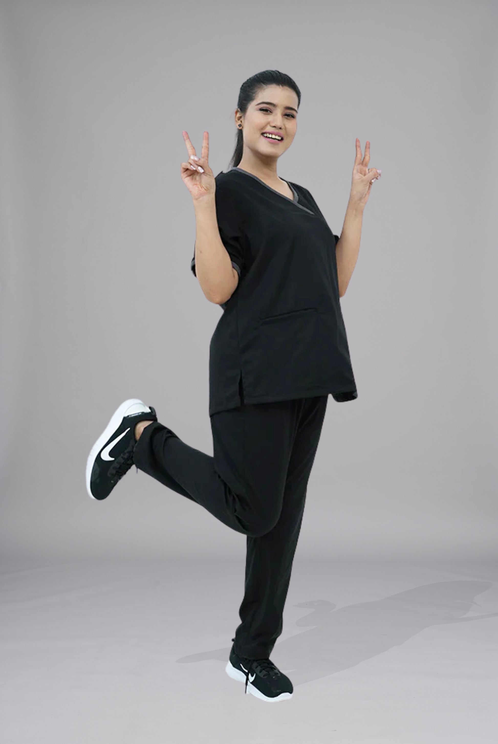 Buy Elite Notch black scrub in Pakistan by Gtex Apparels suitable for healthcare professionals requiring durable everyday workwear 2
