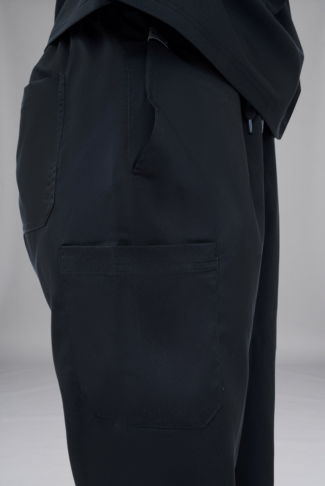 Premium Notch Pro Black Unisex Cotton Lycra Scrub with V-Neck, Straight Fit, One Upper Pocket, Shoulder Pocket and Multiple Trouser Pockets 4
